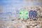 Kids flip flops on beach in front of the sea