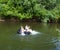 Kids floating on the river