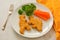 Kids food. nuggets with vegetables. Dinosaur shaped chicken, fish or turkey nuggets, ready to eat