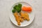 Kids food. nuggets with vegetables. Dinosaur shaped chicken, fish or turkey nuggets, ready to eat