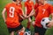 Kids on Football Soccer Team Putting Hands in. Boys Football School Team Huddling