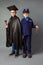 Kids and future education concept. Two kids wearing costume of policeman and judge.