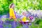 Kids in a garden with bluebell flowers