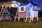 Kids garden house illuminated at night