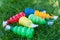 Kids garden multicolored sprayers on the grass