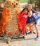 Kids with giant owl scarecrow