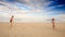 Kids Girl with Pigtail Boy Throw Catch Ball on Sand Beach