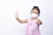 Kids girl wearing mask and show stop hands gesture and great hand for break corona virus concept on white backgrounds