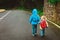 Kids go to school - brother and sister walk on the road