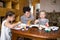 Kids and grandmother painting at home