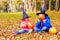 Kids in halloween costume play at autumn park