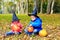 Kids in halloween costume play at autumn park