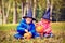 Kids in halloween costume play at autumn park