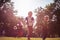 Kids in Halloween suits running trough nature. Focus foreground