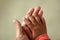 Kids hand with dirty nails on mothers hand before trimming