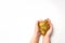 Kids hands stretching and playing golden glitter slime toy on white background. Isolated.