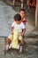 Kids having fun with a bicycle in a Thai village