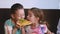 Kids having fun eating pizza in a cafe