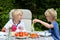 Kids having healthy picnic outdoors