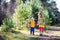 Kids hiking in autumn forest