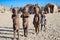 Kids of the Himba Tribe, cute children, little boys with loincloth, Damaraland, Namibia. Huts made of clay and twigs