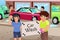 Kids Holding a Car Wash Poster