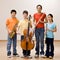 Kids holding saxophone, cello, flute and clarinet