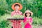 Kids holding seeding plants to planting tree on blurred green nature background
