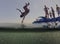 Kids jumping from floating sea platform
