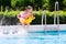 Kids jumping into swimming pool