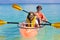 Kids kayaking in ocean. Family in kayak in tropical sea