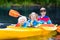 Kids kayaking on a river