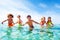 Kids laughing and playing in water at the seaside