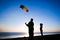 Kids launching the rainbow kite together