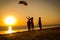 Kids launching the rainbow kite together