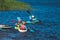 Kids learn kayaking, canoeing whitewater training in the lake river, children practicing paddling, yound kayakers in summer camp