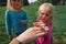 Kids learning - kids looking at and exploring lizard in nature