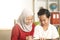 Kids learning together, muslim sister help or teach her little brother to do home work, education and happy family concept