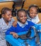 Kids looking at computer in school class room in Africa.