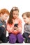 Kids looking at smartphone