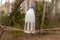 Kids-made homemade bird feeder in the park. Feeding trough from a plastic bottle