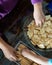 Kids making Kek Batik or Malaysian Triple Chocolate Dessert. Doing the initial steps, crushing the cookies into tiny pieces