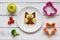 Kids menu owl shaped sandwich with vegetables and fruits