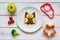 Kids menu owl shaped sandwich with vegetables and fruits