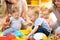 Kids with moms playing in day care centre