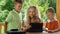 Kids and mother video chats with tablet pc