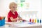 Kids paint. Child painting. Little boy drawing