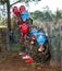 Kids paintball players aiming outdoors