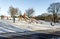 Kids with parents enjoy sleigh slope rides on a snow slope in Duthie park, Aberdeen, Scotland