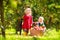 Kids picking apples on farm in autumn